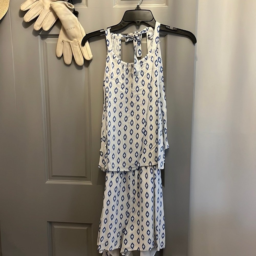 Cute open back romper. Size L